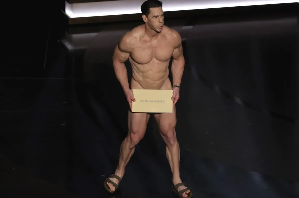 John Cena sitting naked on stage