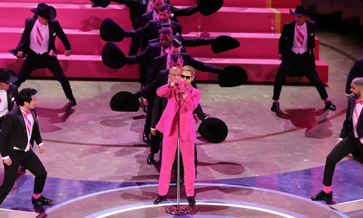 Ryan Gosling standing on stage singing I'm Just Ken