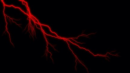 A crack of red lightning against a black background.