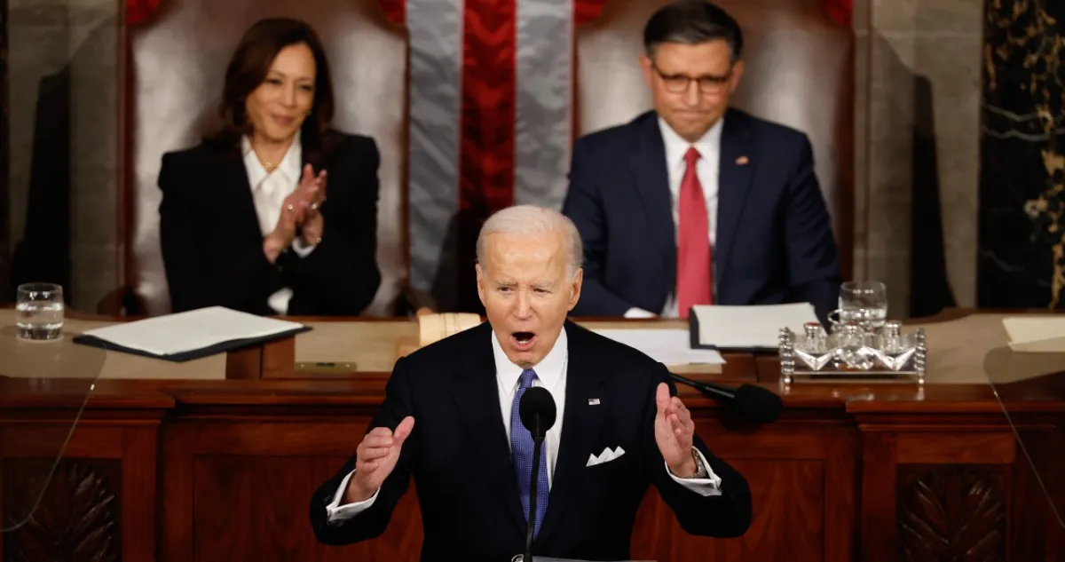 Joe Biden, flanked by VP Kamala Harris and Speaker Mike Johnson, delivers the State of the Union address.