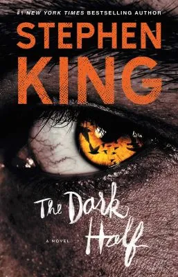Cover of Stephen King's The Dark Half; His name is in orange, the title in white scribbled text, over a sepia image of a yellow eye with shadows of birds on he iris.