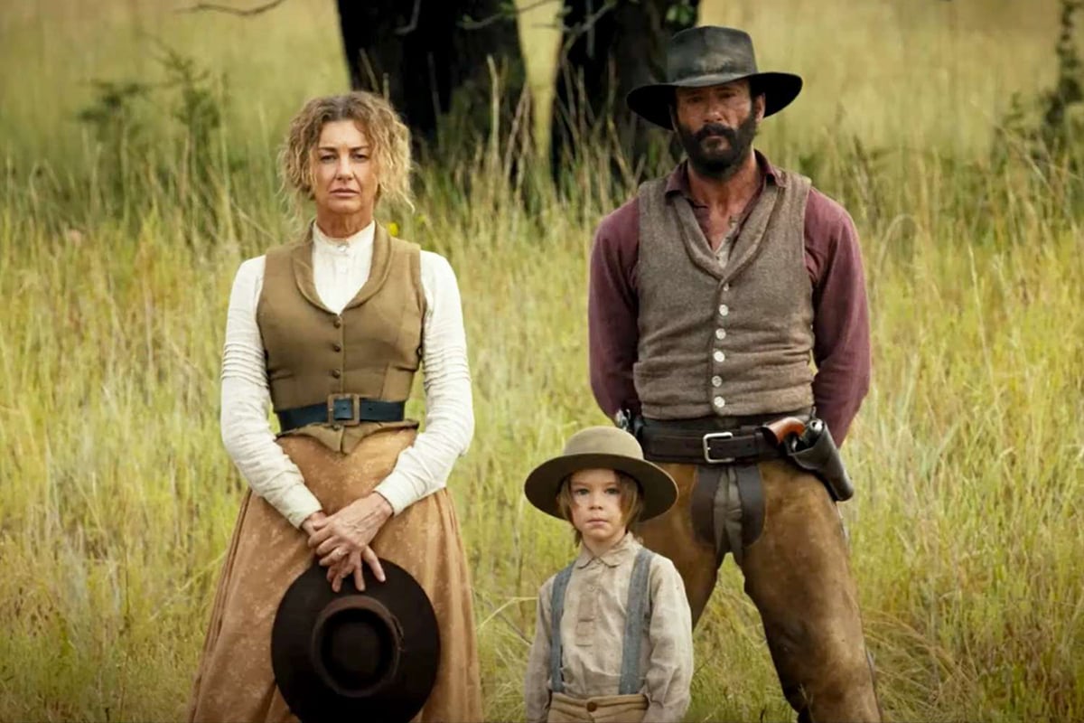 faith hill and tim mcgraw as the dutton family standing in a field