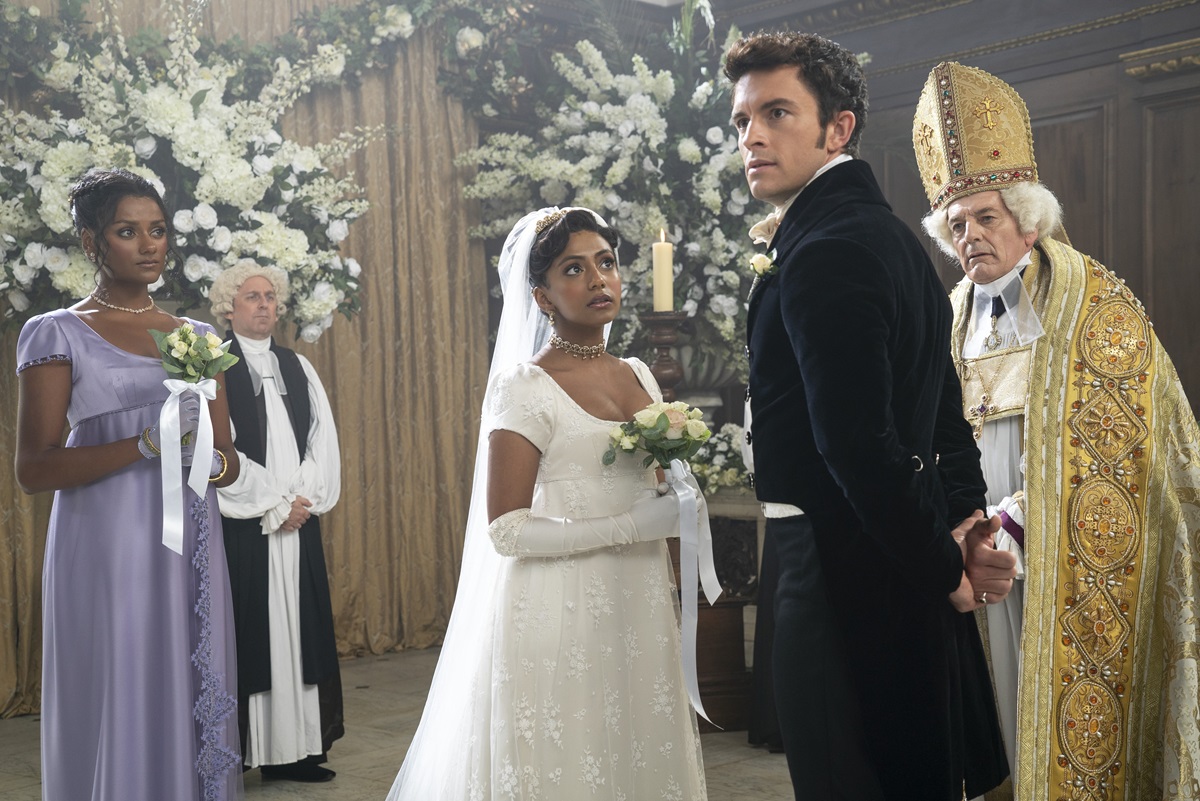 Anthony and Edwina at the altar while Kate looks on)