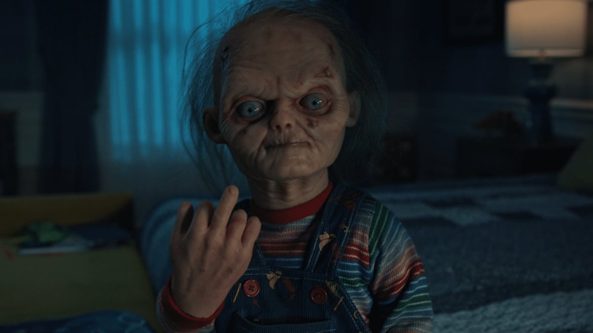 An aging Chucky flips the middle finger at his TV in season 3 of 'Chucky'