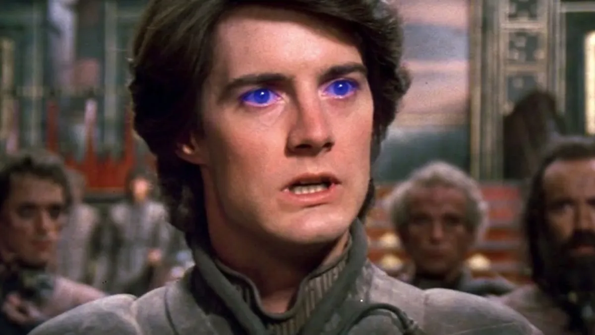 Paul with glowing blue eyes looks serious in "Dune" (1984)