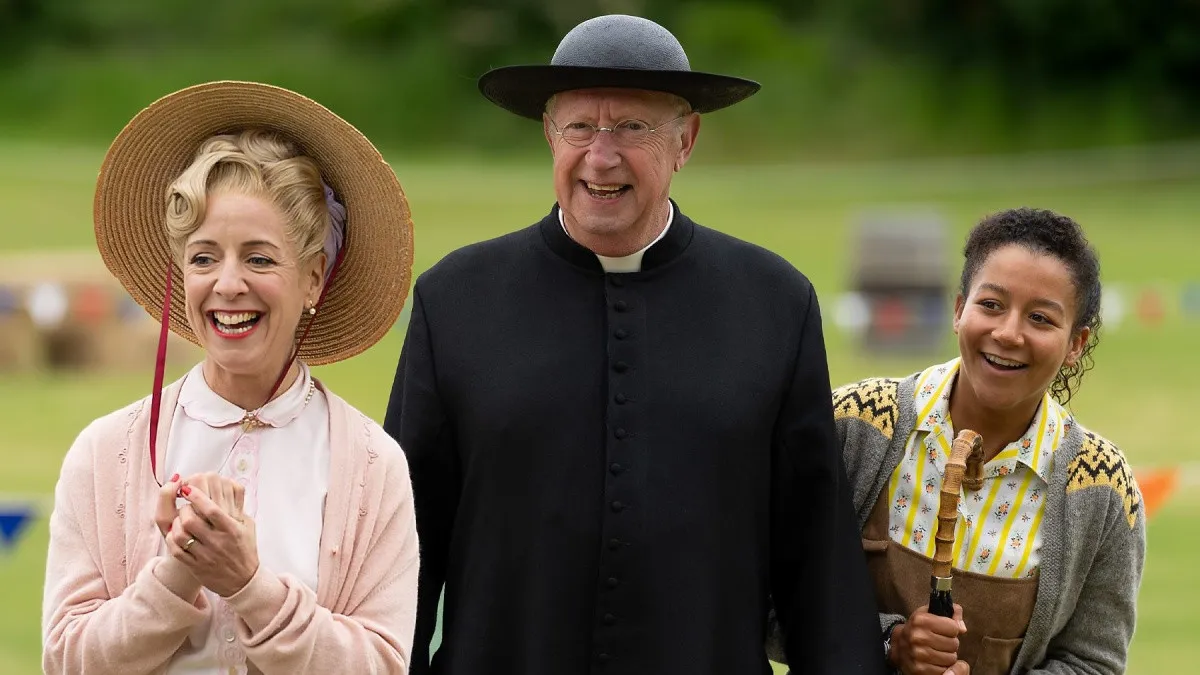 From left to right: Claudie Blakely as Mrs Devine, Mark Williams Father Brown, and Ruby-May Martinwood as Brenda in Father Brown