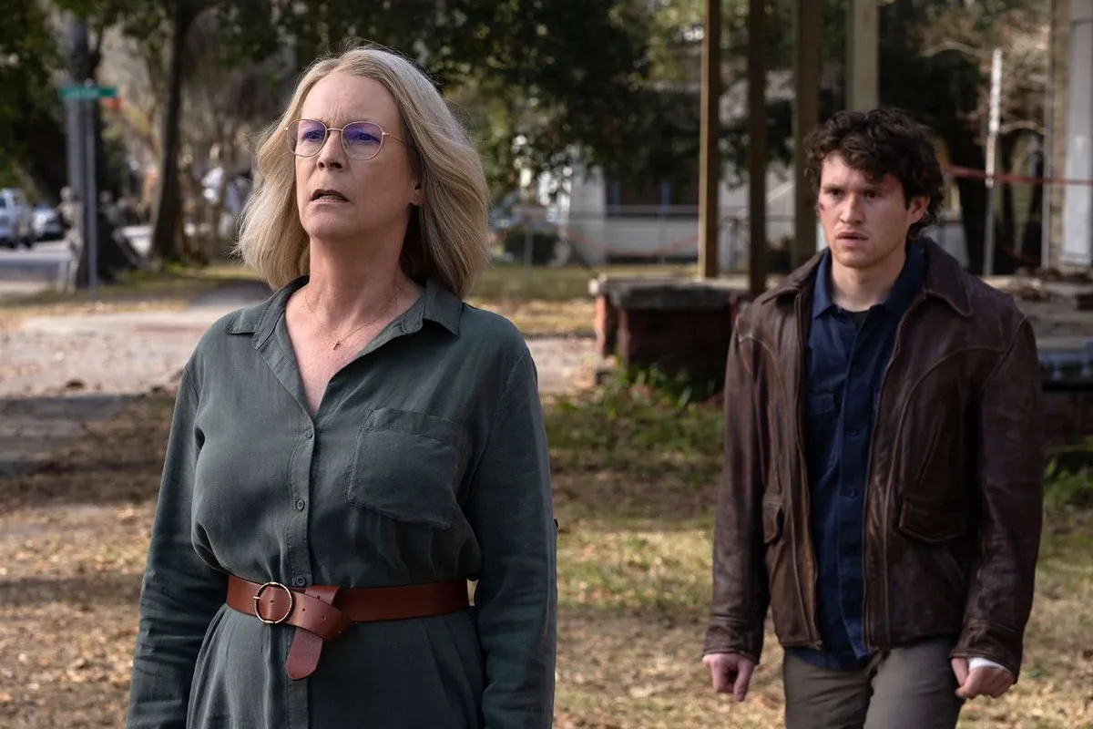 Laurie Strode standing on the street with a young man in "Halloween Ends" 