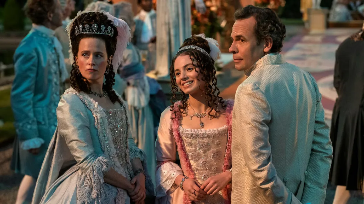 Lady Ledger, Violet Ledger, and Lord Ledger together at a ball in Queen Charlotte: A Bridgerton Story