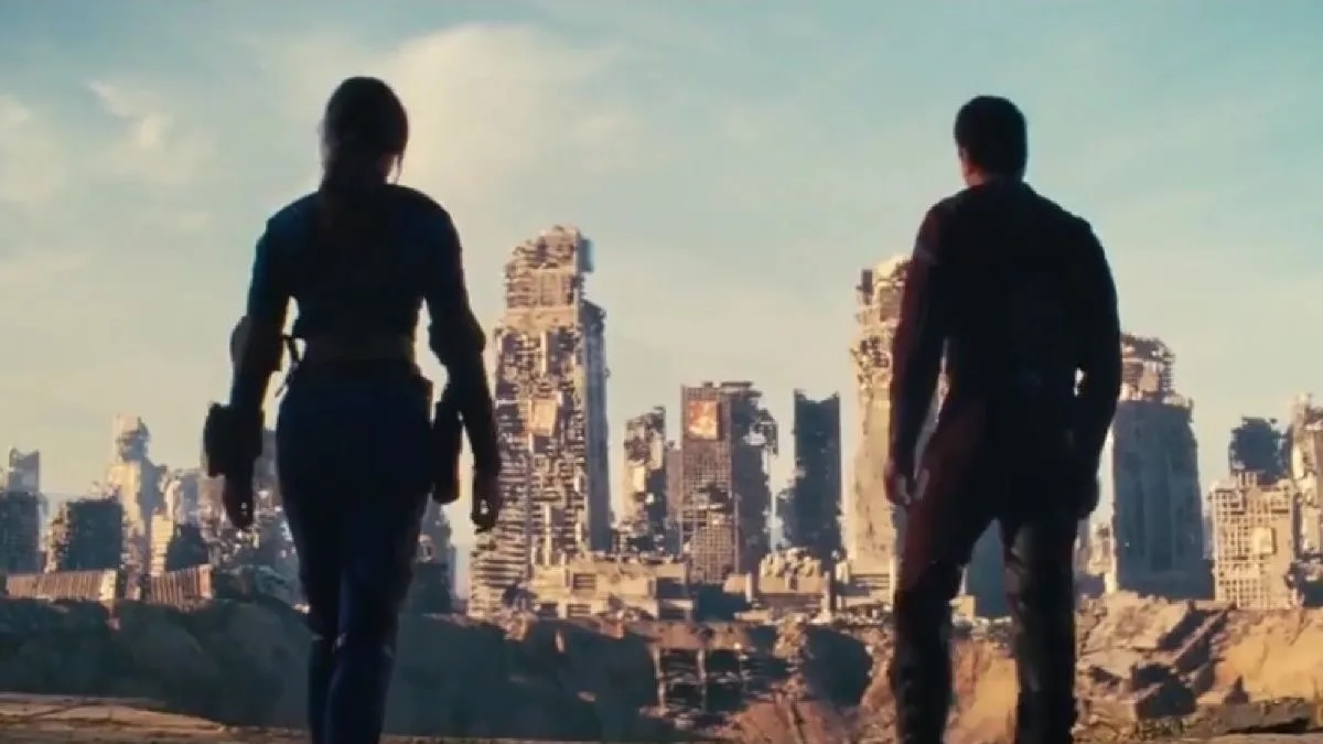 Image of the silhouettes of Lucy and Maximus overlooking the ruins of Shady Sands in a scene from Prime Video's 'Fallout."