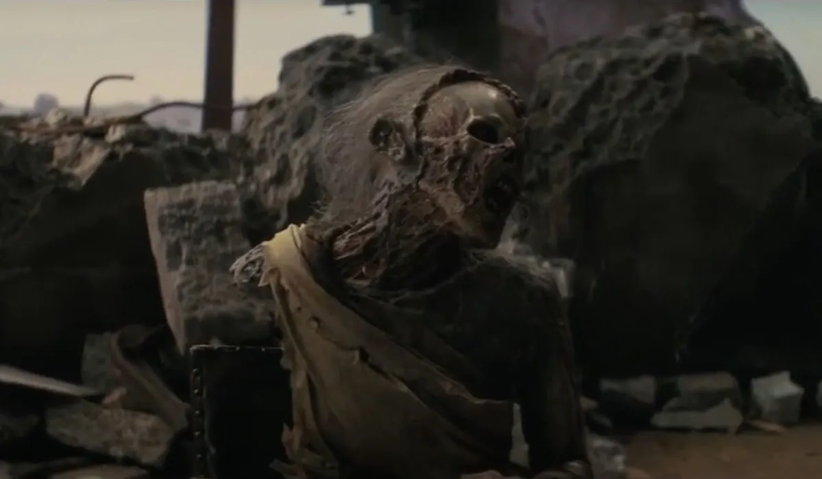 A scene from Prime Video's 'Fallout.' Lucy's mom, Rose, as a very old, decrepit ghoul seated in a chair. 