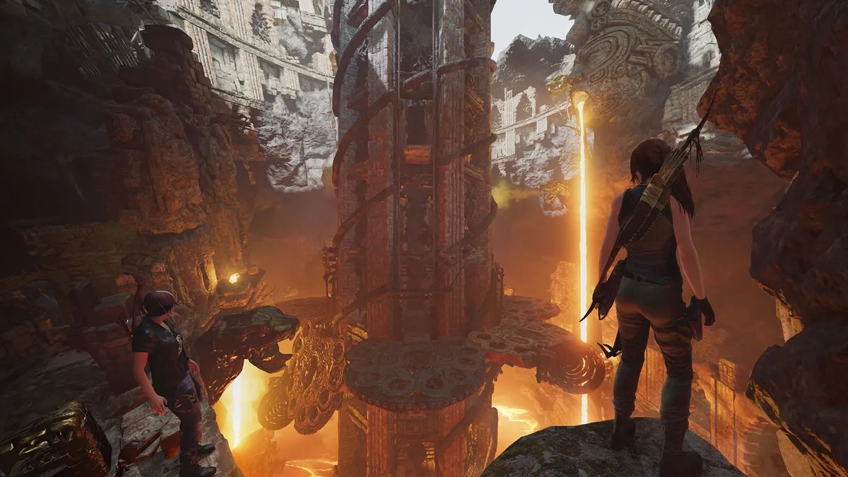 Lara Croft stands in a lava filled cavern in "Shadow of the Tomb Raider" 