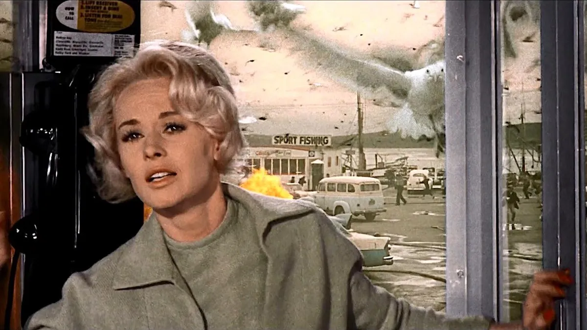Tippi Hedren trapped in a phone booth in The Birds
