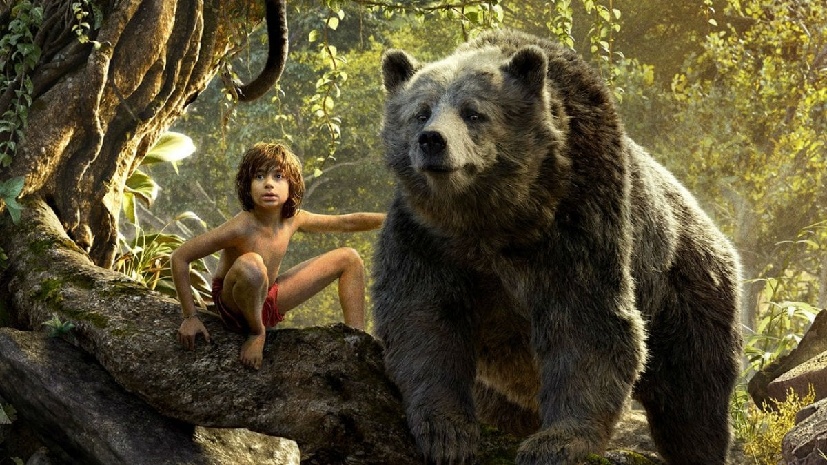 Mowgli (Neel Sethi) and Baloo the bear in The Jungle Book
