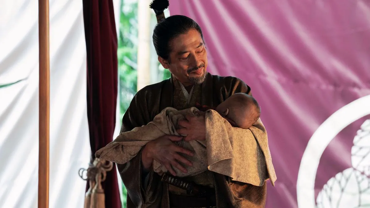 Hiroyuki Sanada as Lord Yoshii Toranaga holding is son in episode 10 of Shogun