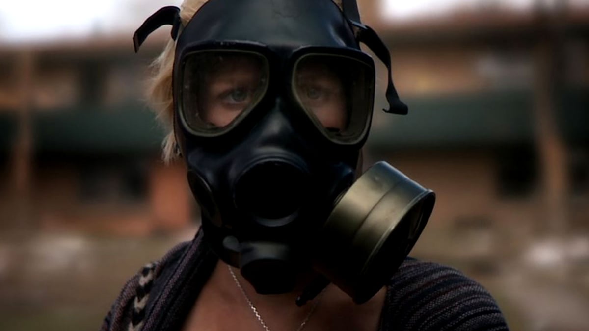 Whitney Able, wearing a gas mask, in 'Monsters'