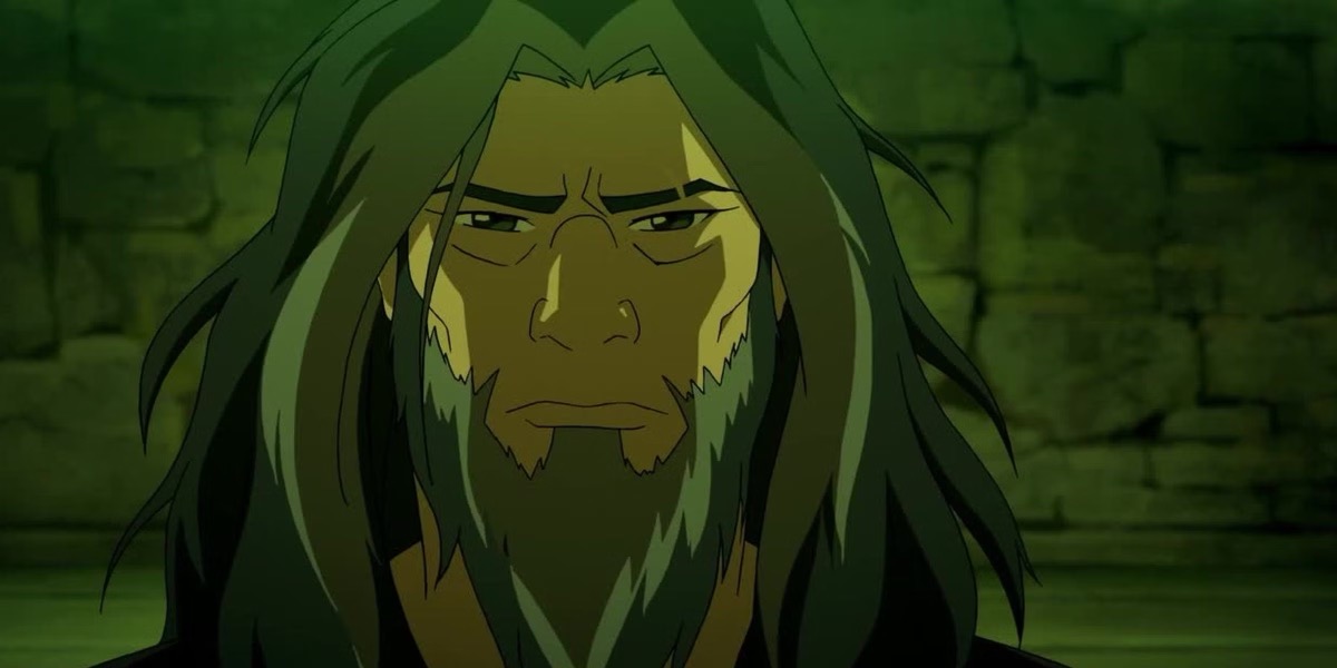 Zaheer with long hair and beard sits pensive in a cave in "The Legend of Korra"