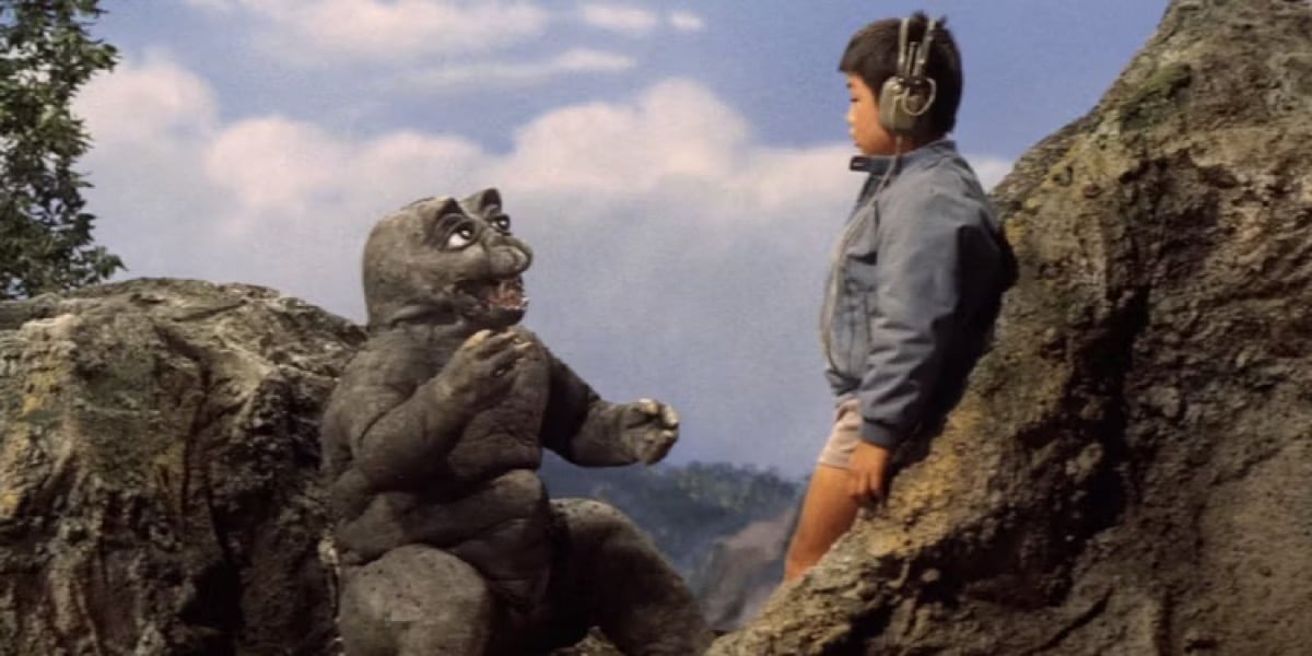 Baby monster Minilla talks to a little boy in "All Monsters Attack"