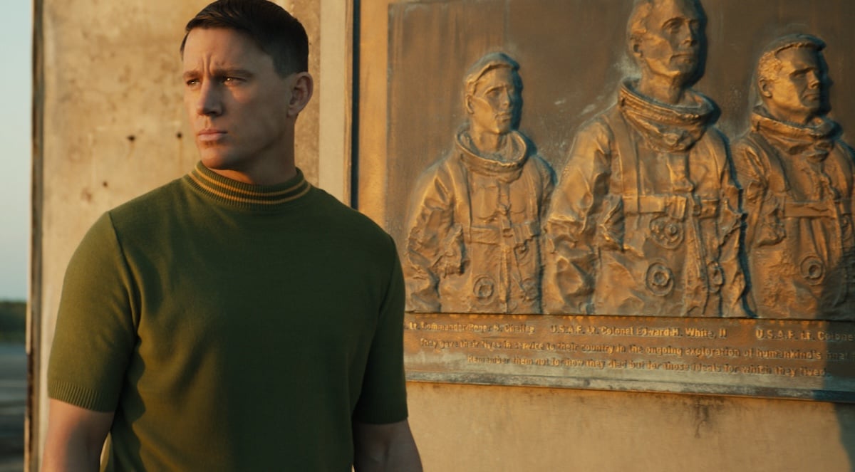 Channing Tatum standing next to a plaque in Fly Me to the Moon