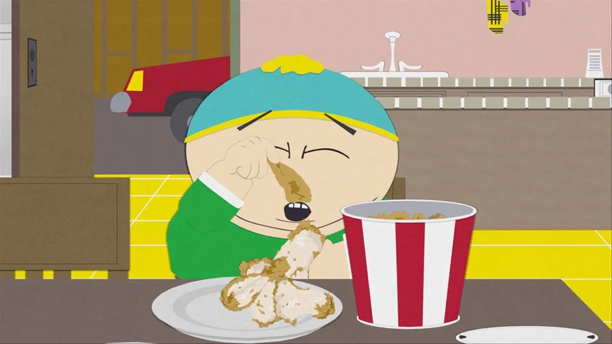 Cartman eats the skin off of KFC chicken in "South Park"