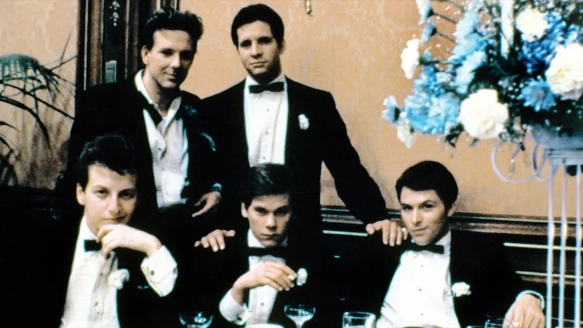 Five boys in tuxes sit around a table in "Diner" 