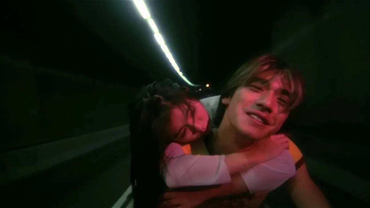 A couple rides a motorcycle in a tunnel in "Fallen Angels" 