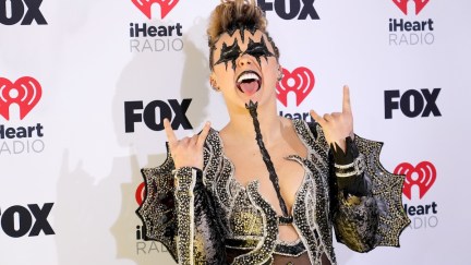 Jojo Siwa looking like a member of Kiss on a read carpet