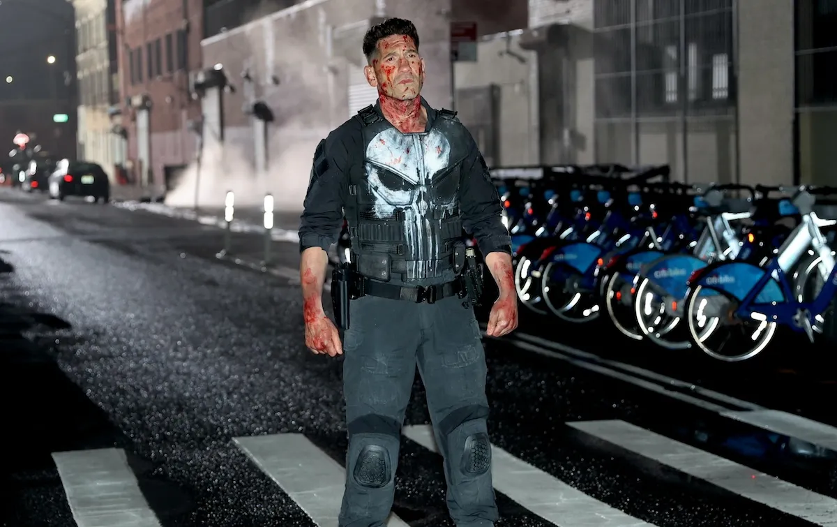 Frank castle standing by some citi bikes