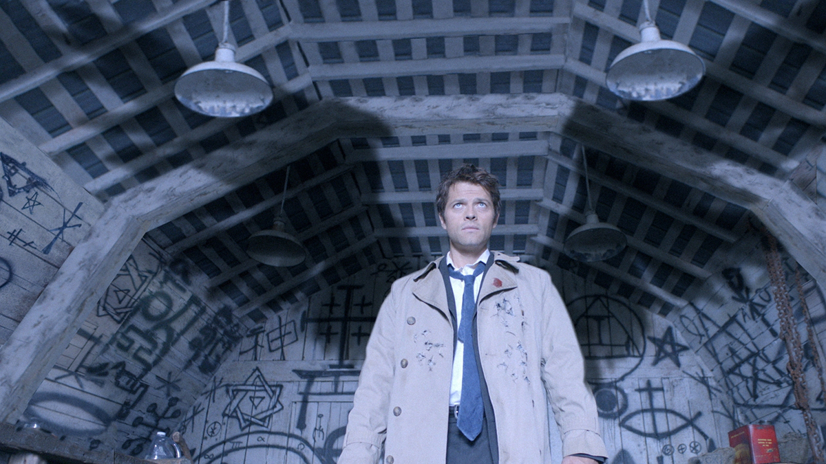 Castiel standing with wings behind him in supernatural