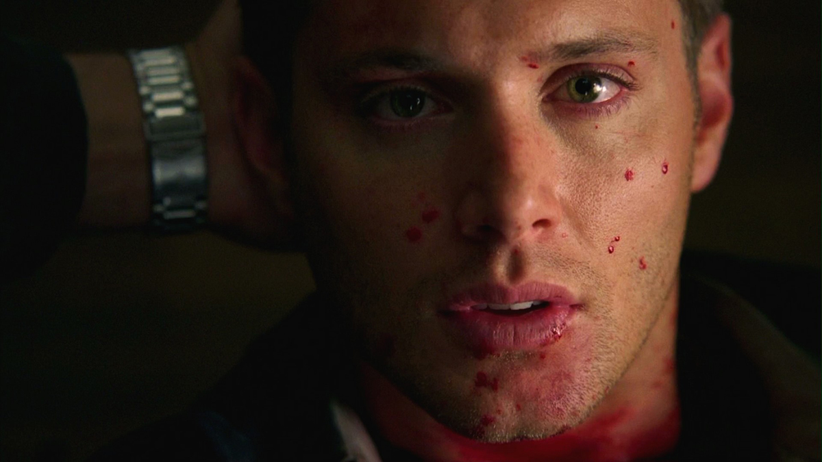dean laying dead on the ground in supernatural