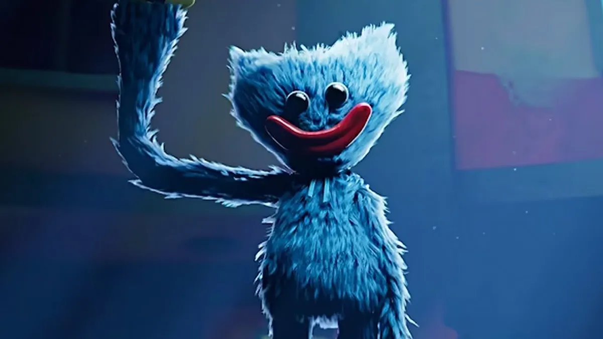 A fuzzy monster smiles and waves in "Poppy Playtime"