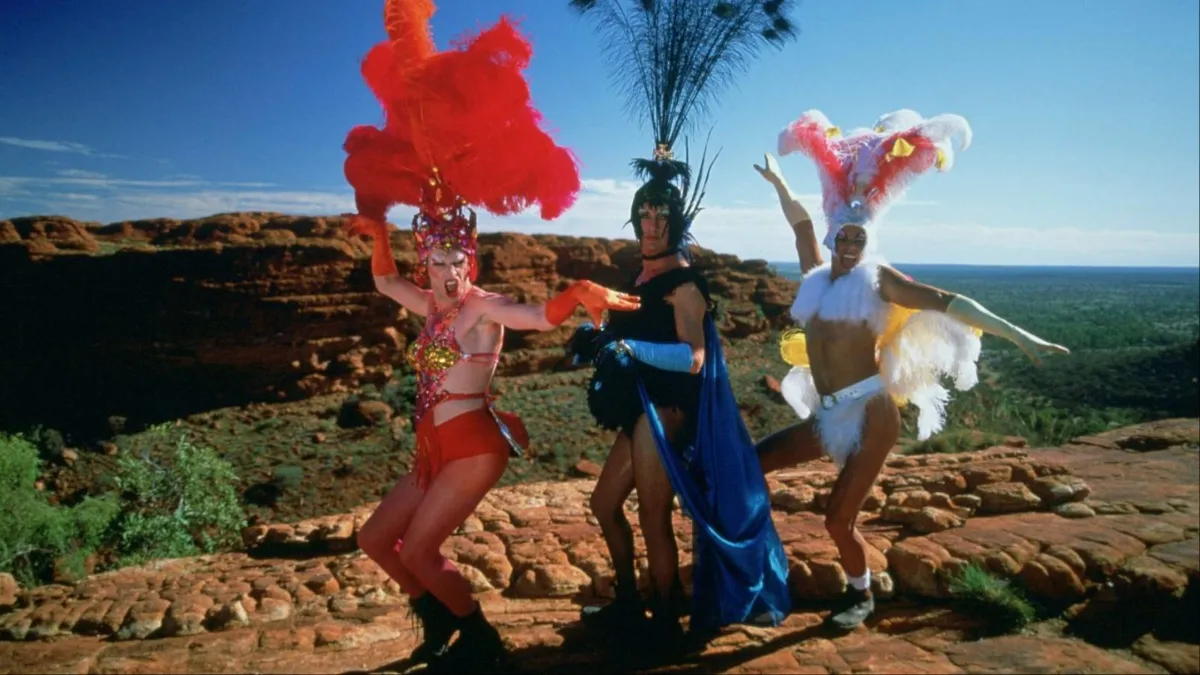 Three drag queens stand on top of Kings Canyon in 'The Adventures of Priscilla, Queen of the Desert'.