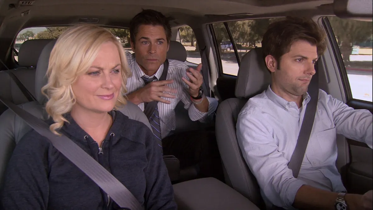 ben, leslie, and chris all in a car together in parks and rec