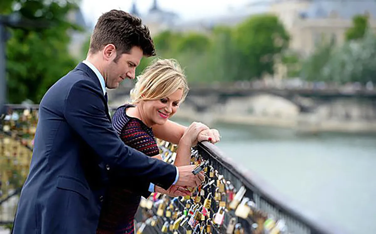 ben and leslie at the lock bridge in paris