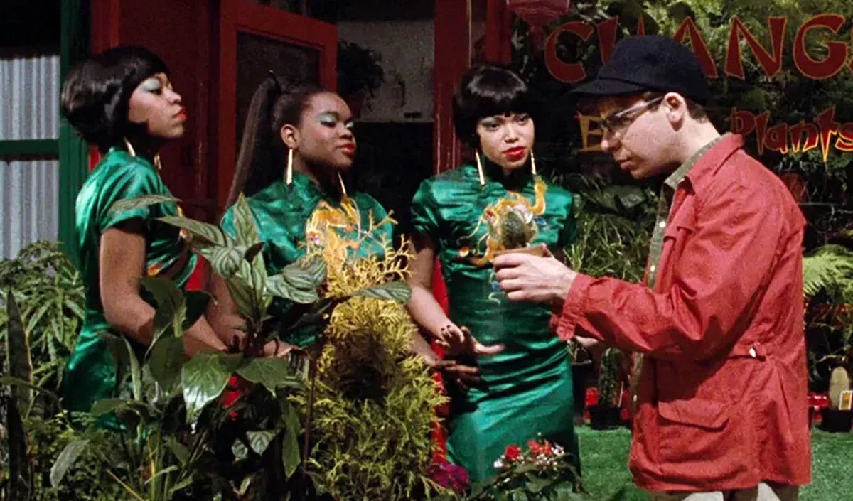 the singers with seymour in little shop of horrors looking at plants