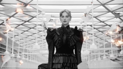 Taylor Swift wears an old-timey black dress in the music video for 'Fortnight'.
