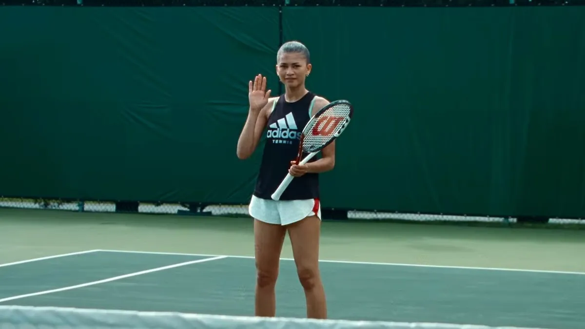 Zendaya on a tennis court with a racket
