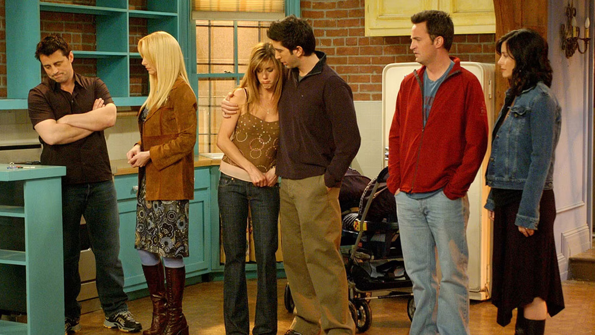 The cast of Friends in the final episode of the series, standing in the kitchen of Monica and Chandler's apartment.