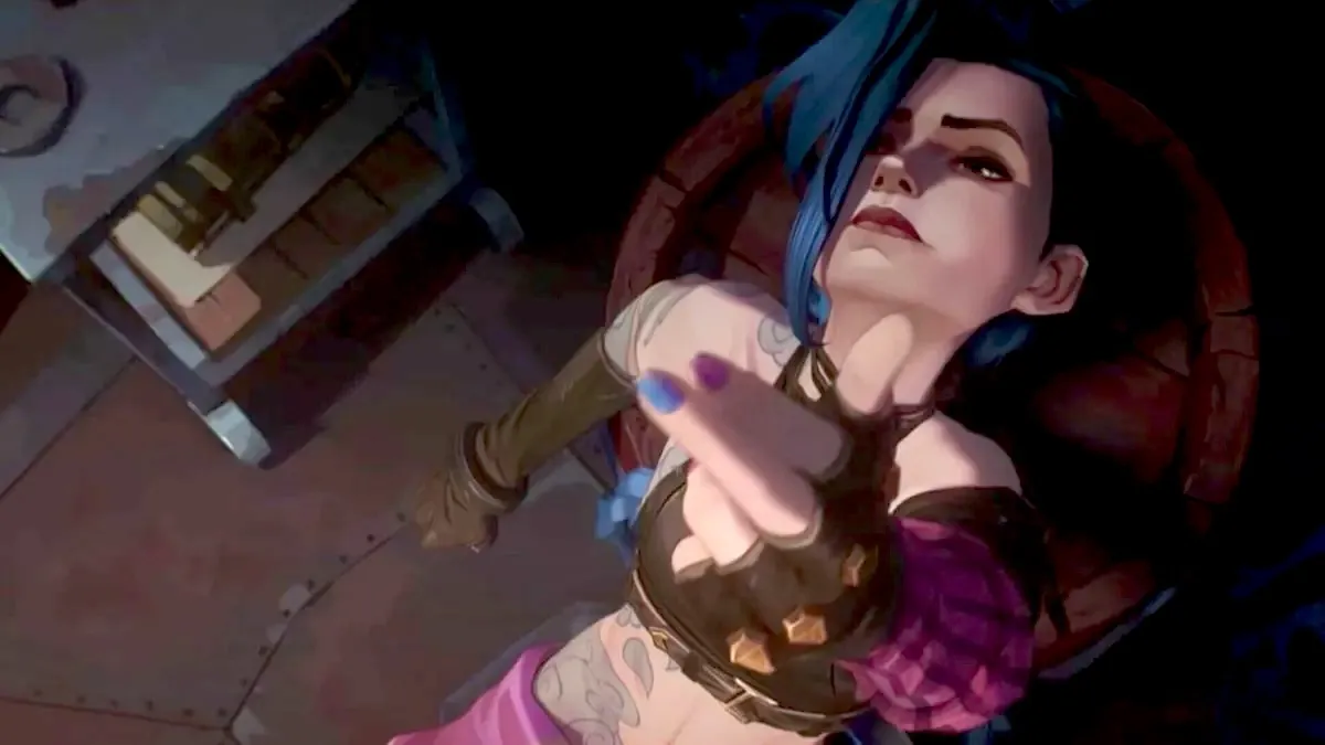 Image of Jinx in a scene from Netflix's "Arcane." She is a white teenage girl with blue hair, a steampunk outfit bearing a lot of skin, and blue and pink nail polish. She's leaning back in a chair and calmly looking up at the ceiling pointing a finger gun at it.
