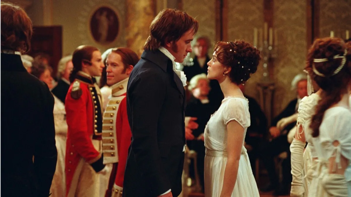 Pride and Prejudice 2005, Elixabeth Bennet and Mr. Darcy face off in a ballroom. Kiera Knightly and Matthew Macfayden