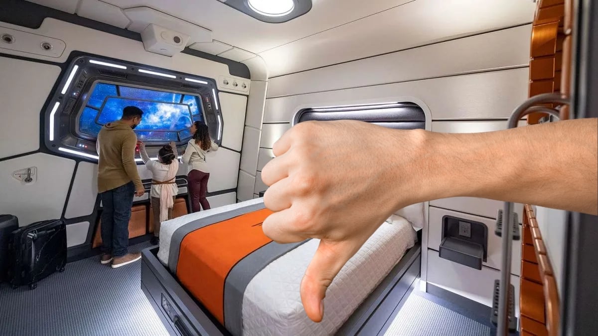 The interior of a guest suite at the defunct Star Wars Galactic Cruiser at Walt Disney World, with a hand giving a thumbs down