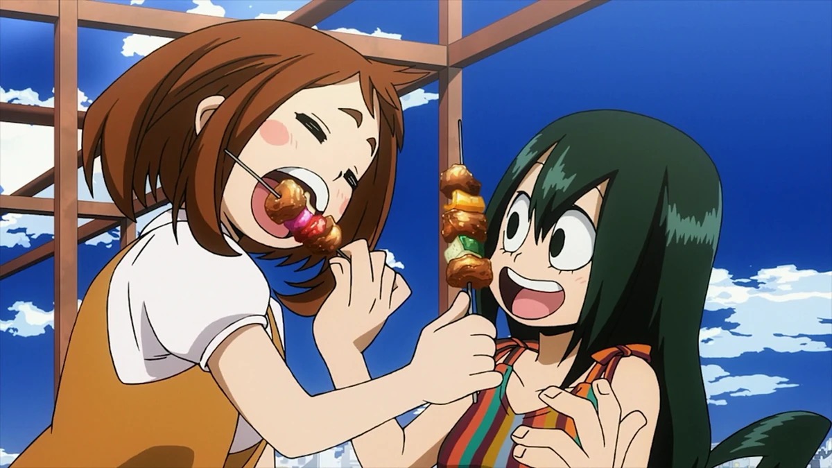 Ochako and Tsuyo eating snacks and smiling in "My Hero Academia"