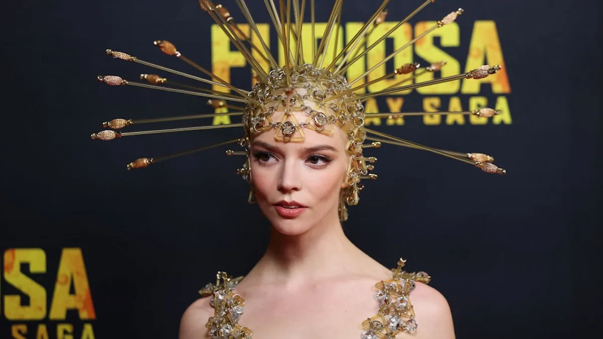 Anya Taylor Joy wearing a spiked gold headdress.