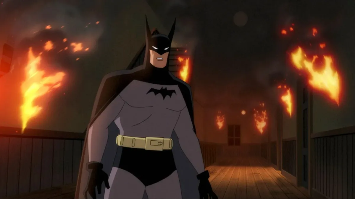 Batman is surrounded by flames in 'Batman: Caped Crusader'.