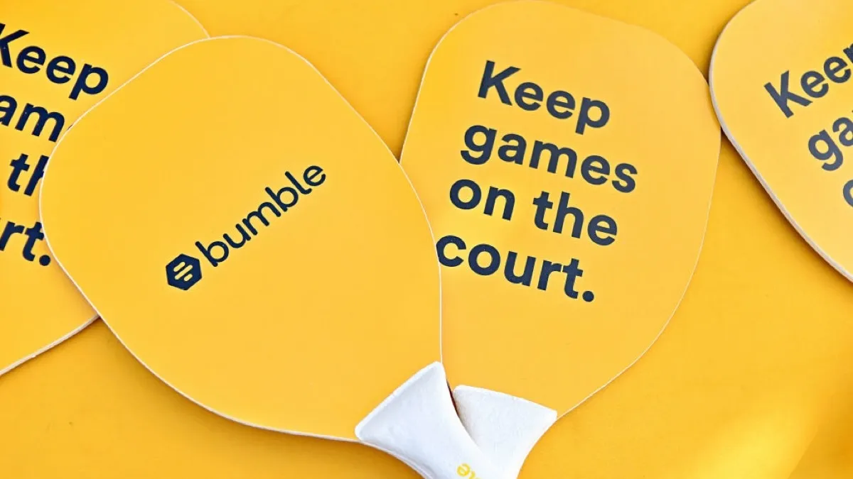Pickleball paddles with Bumble slogan: "Keep games on the court."