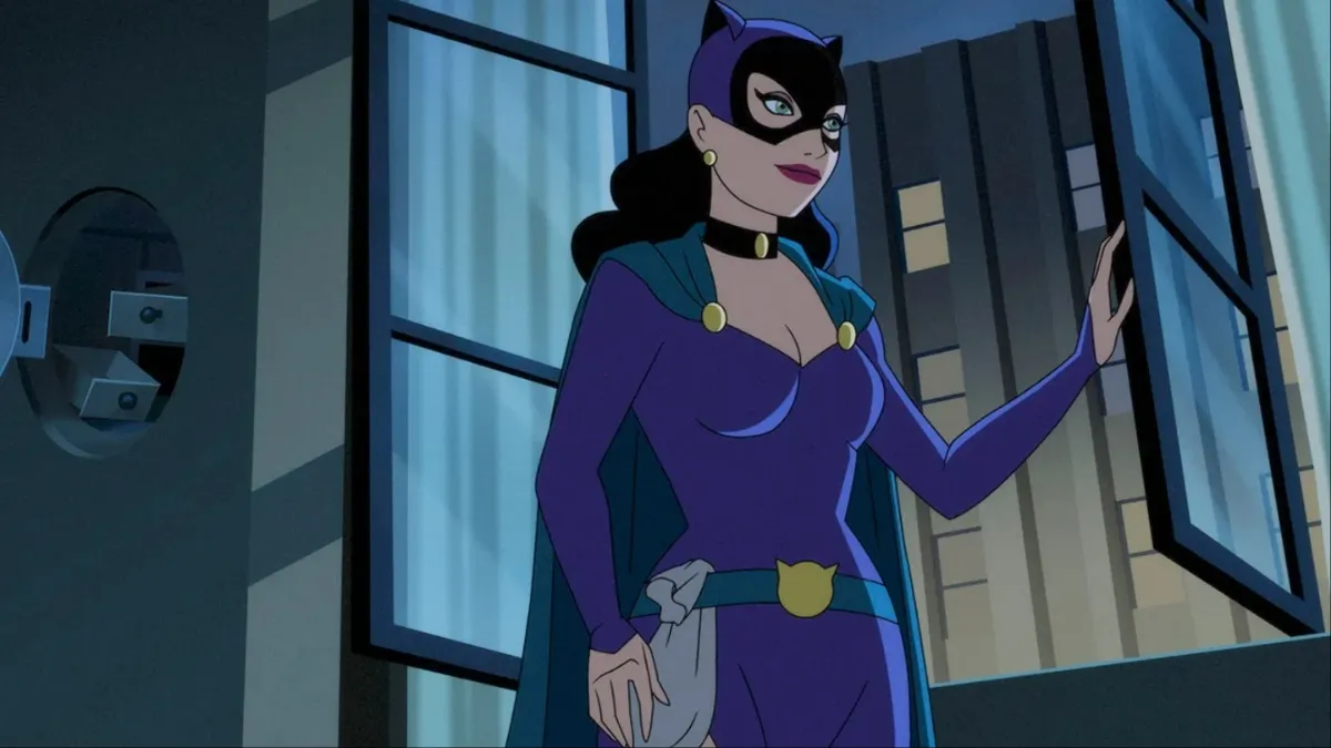 Catwoman stands by an open window in 'Batman: Caped Crusader'.