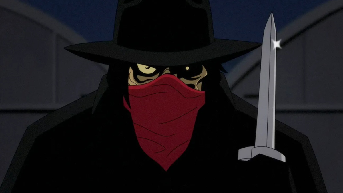 Clayface wears a black hat and a red bandana across his face, and holds a knife.