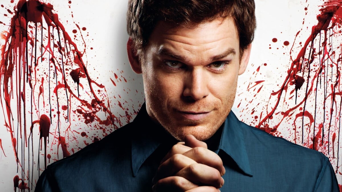 Michael C. Hall stands in front of some blood spatter in a 'Dexter' promotional image.