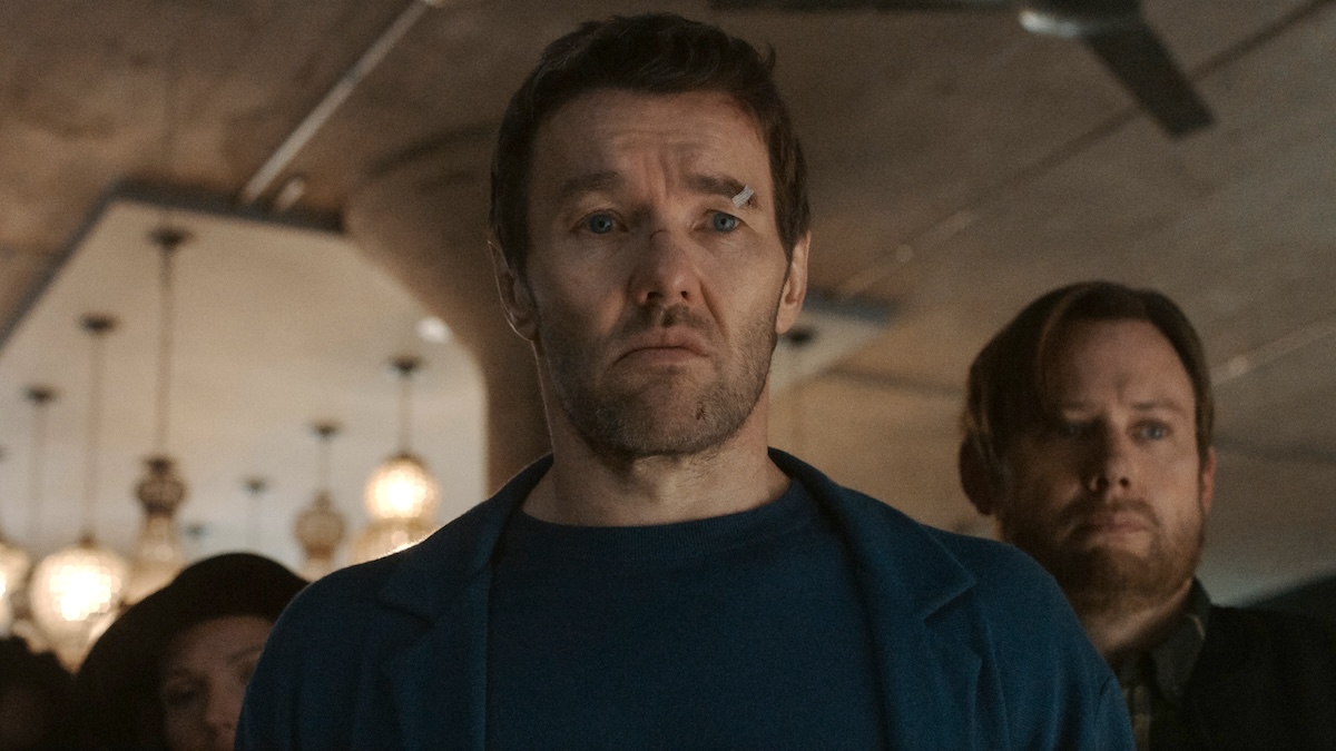 joel edgerton standing with jimmi simpson in a room in dark matter