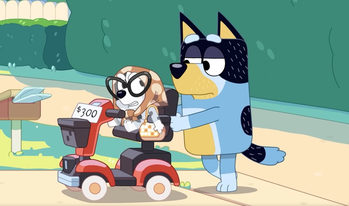 Bandit pushing Muffin on a motorized scooter
