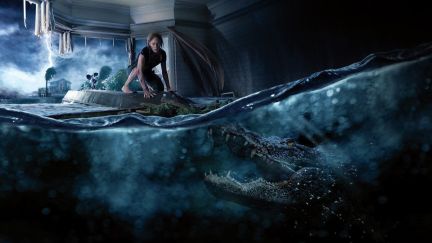 A woman in a flooded house flees an alligator lurking under the water in 